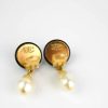 Elegant Chanel pearl earrings featuring gold accents, sophisticated jewelry designed for women, perfect for fashion-forward accessories, made in France, luxury earrings, women's jewelry.