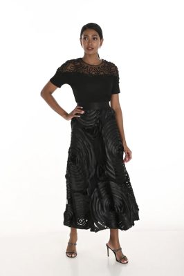 Elegant black designer outfit featuring intricate lace detailing and statement fabric textures for women’s fashion and evening wear.