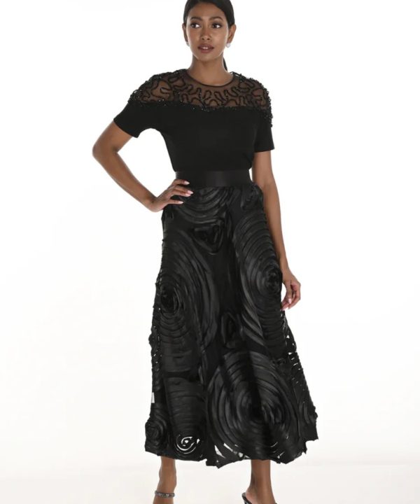 Elegant black designer outfit featuring intricate lace detailing and statement fabric textures for women’s fashion and evening wear.