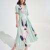 1. Elegant floral pleated dress by Katy Amaker featuring pastel colors, flowy design, and modern style perfect for spring or summer occasions.