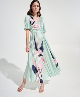 1. Elegant floral pleated dress by Katy Amaker featuring pastel colors, flowy design, and modern style perfect for spring or summer occasions.