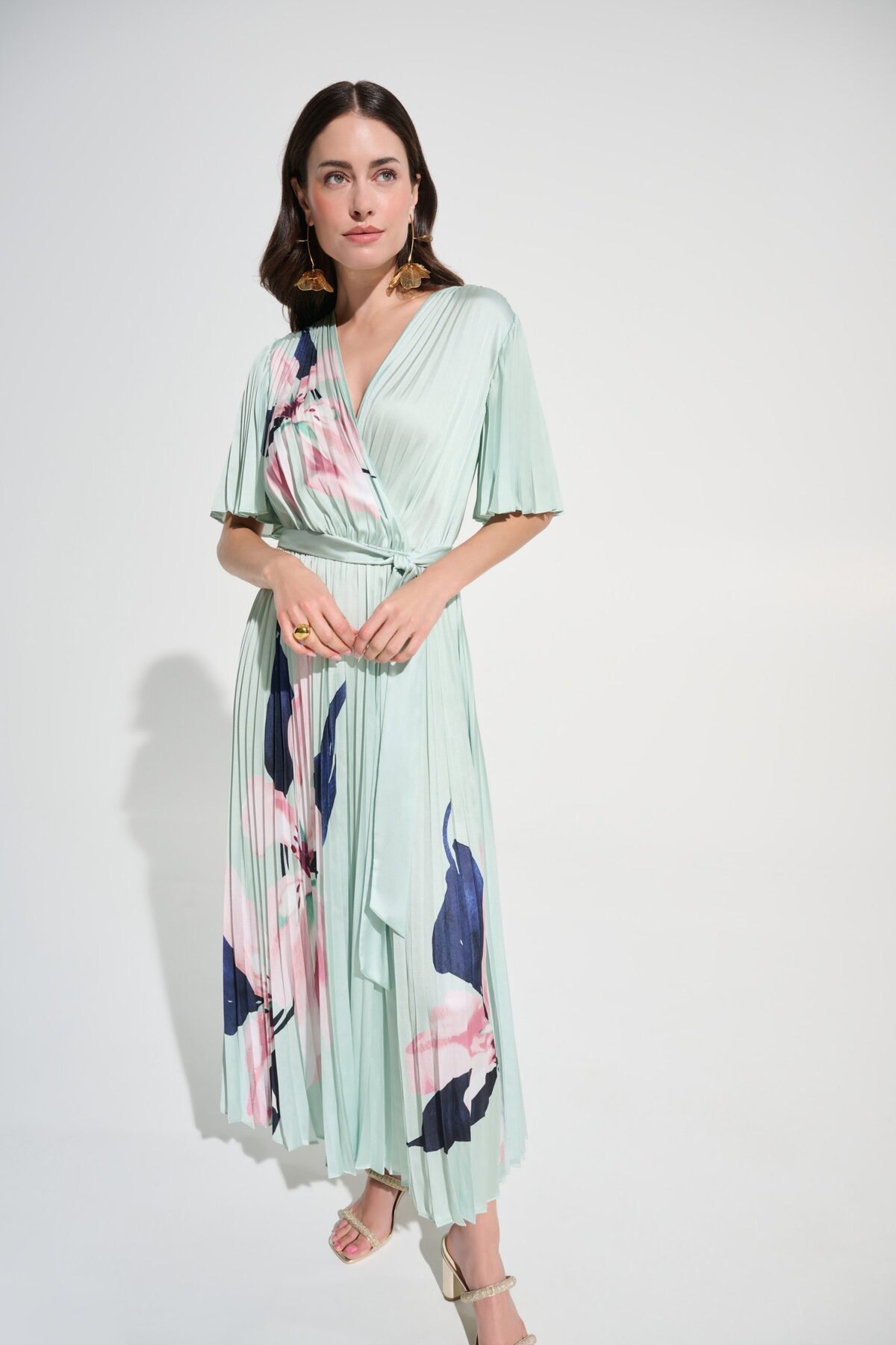 1. Elegant floral-printed pleated midi dress in mint green, perfect for summer events, by Katyamaker.