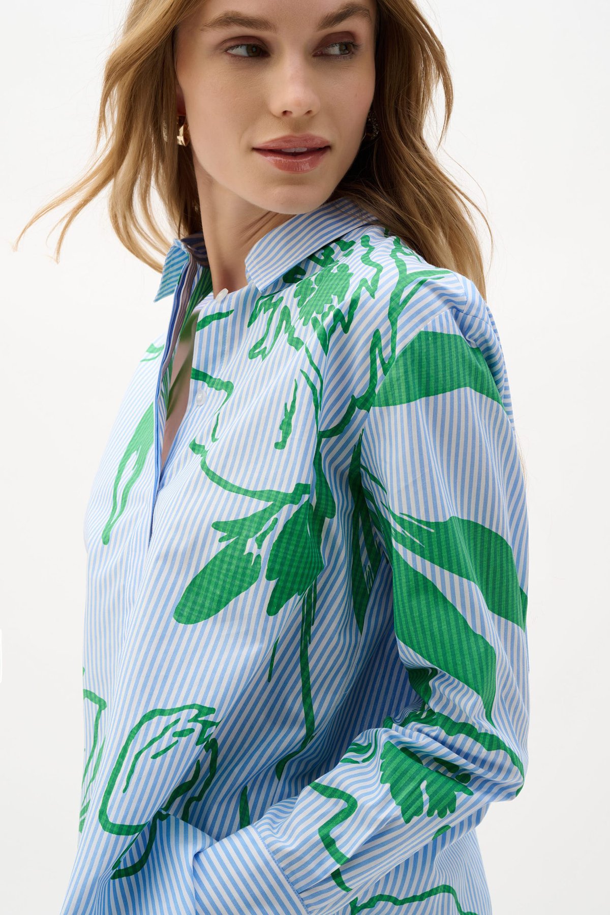 Vibrant green botanical print shirt by Katy A Maker featuring blue and white pinstripes, modern design, and stylish collar. Perfect for contemporary fashion, eco-friendly fabrics, and statement shirts.