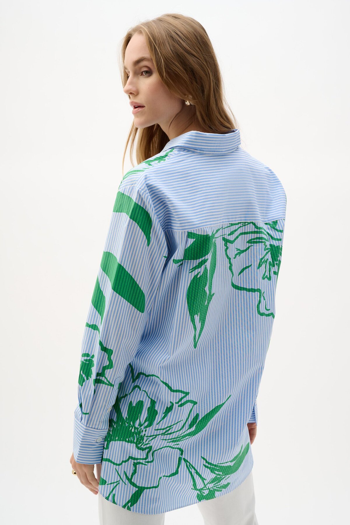 Blue striped shirt with green floral print by KATYAMAKER, perfect for modern casual wear and artistic fashion statements.